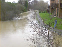 January 2nd 2003, 2.30 pm - River Flit in flood (View east from bridge)