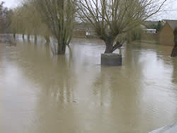 January 2nd 2003, 2.30 pm - River Flit in flood (View west from bridge)