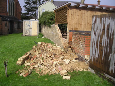 Some of the rubble left after another section of the boundary wall collapses