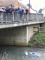 PHOTO: Shefford youngsters pulling water from the river in buckets